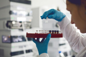 Chemists prepares protein samples in analytical lab